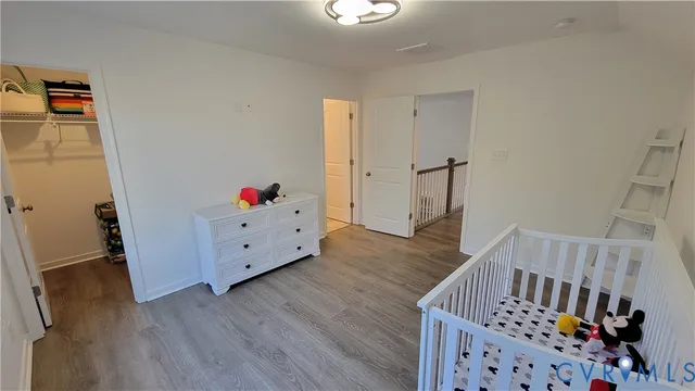 a view of an entryway with wooden floor