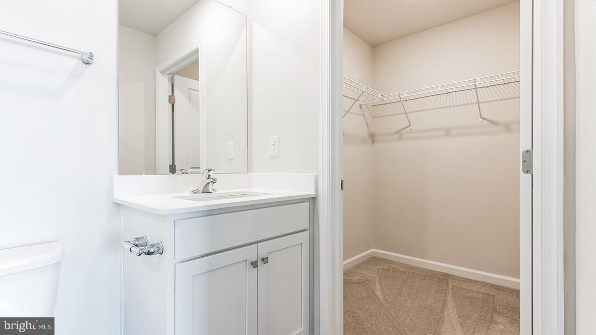 313 Vero Road Egg Harbor Township, NJ 08234 - Photo 11 of 14 a bathroom with a sink and mirror