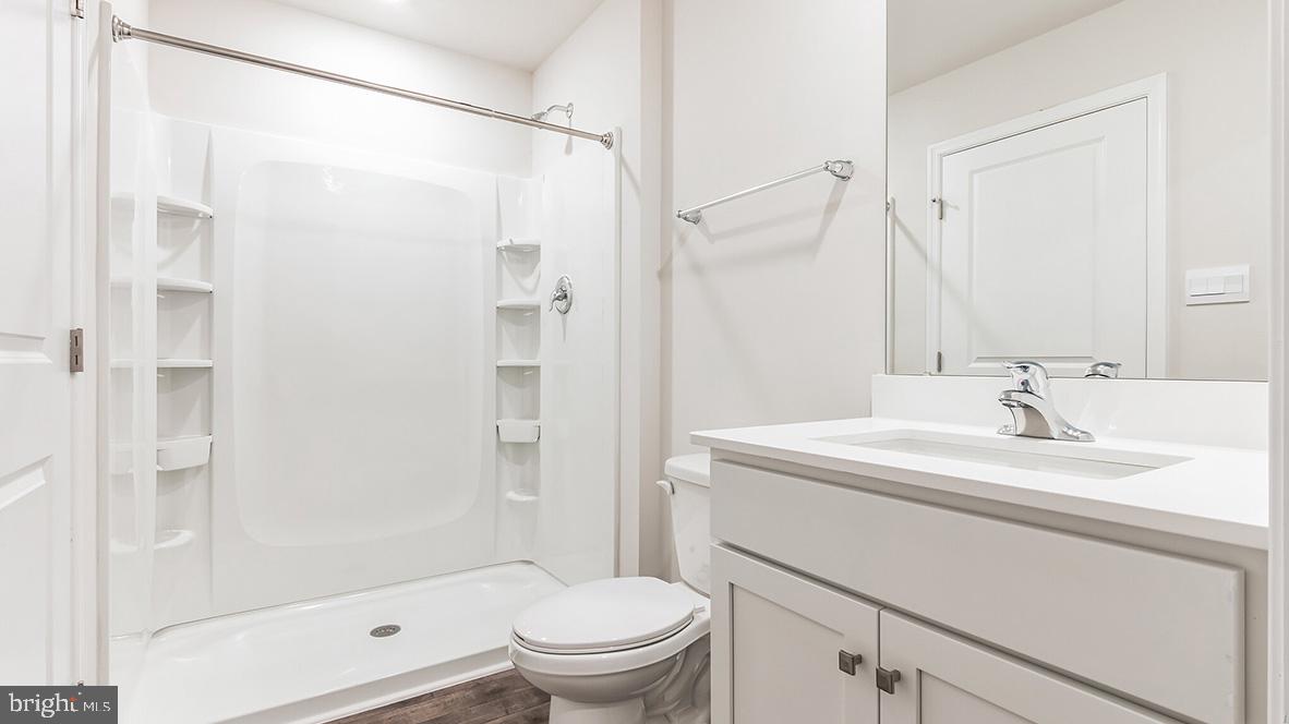 313 Vero Road Egg Harbor Township, NJ 08234 - Photo 13 of 14 a bathroom with a sink toilet and shower