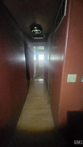 a view of an empty room with a fireplace