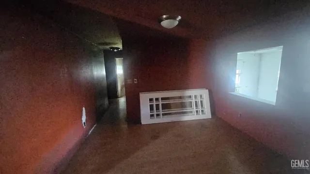 a view of an empty room and window