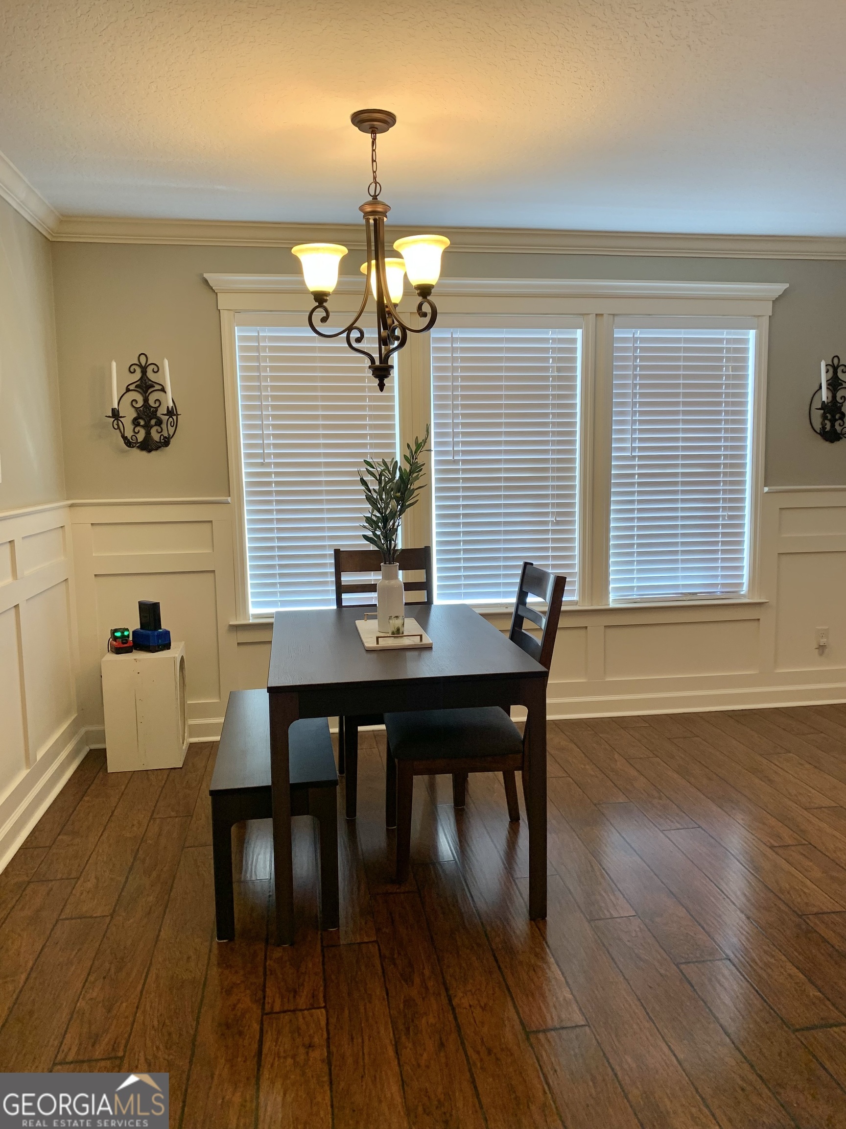 4192 Bright Creek Road Hahira, GA 31632 - Photo 14 of 28 a view of a dining room with furniture wooden floor and chandelier