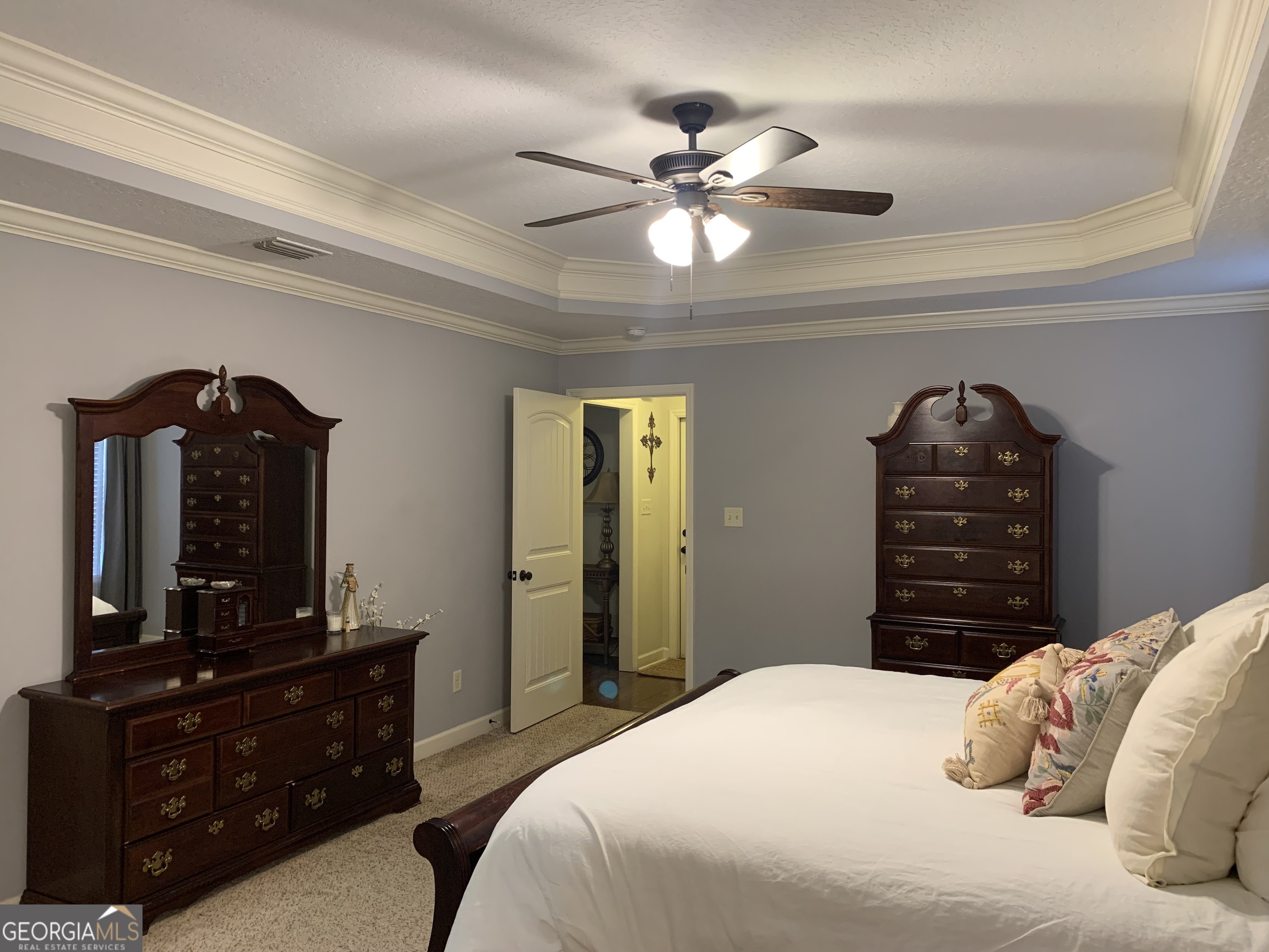 4192 Bright Creek Road Hahira, GA 31632 - Photo 17 of 28 a bedroom with a bed and a dresser