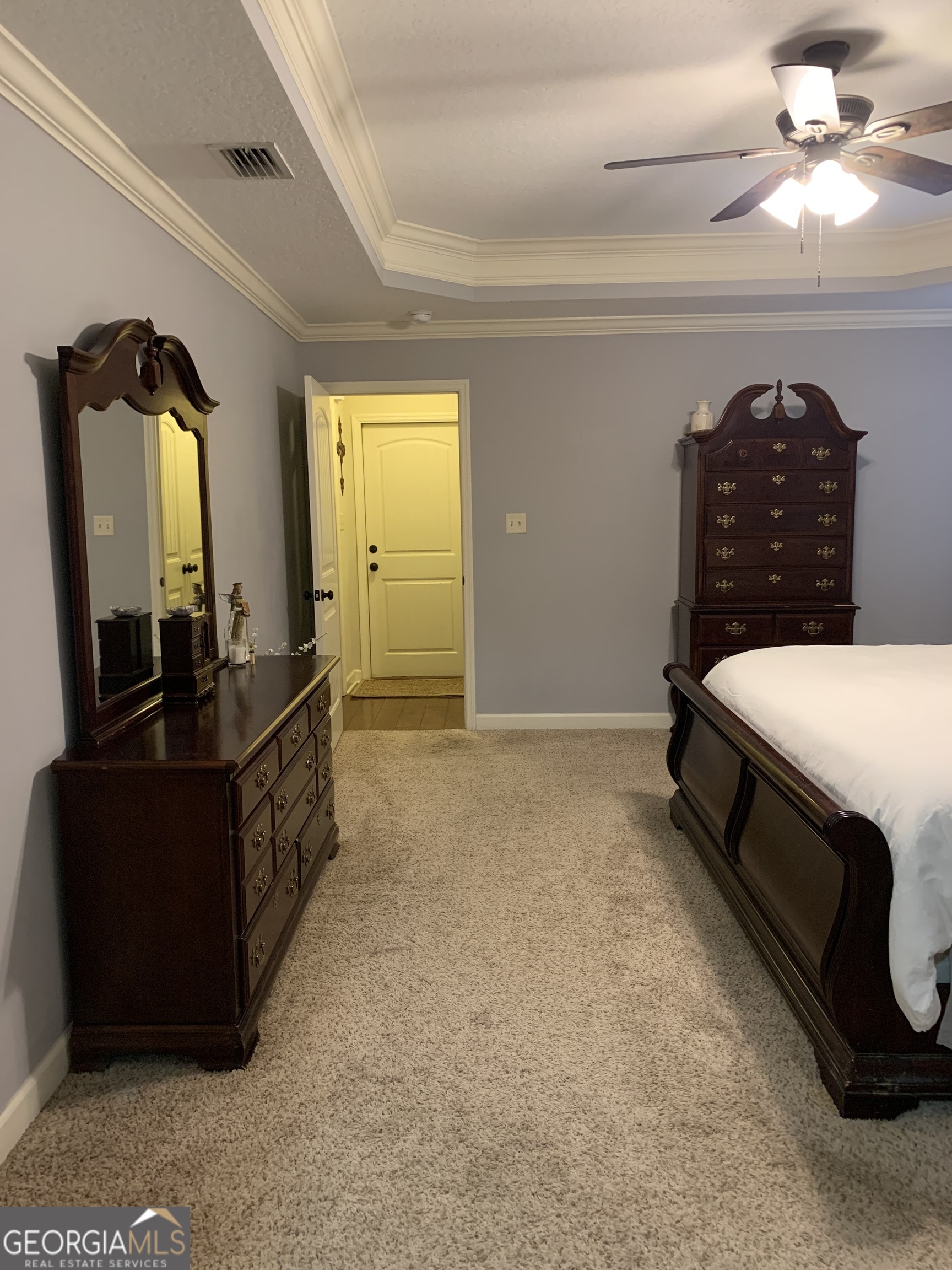 4192 Bright Creek Road Hahira, GA 31632 - Photo 18 of 28 a bedroom with a bed and a dresser