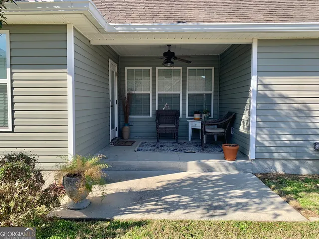 a view of a backyard with a tree