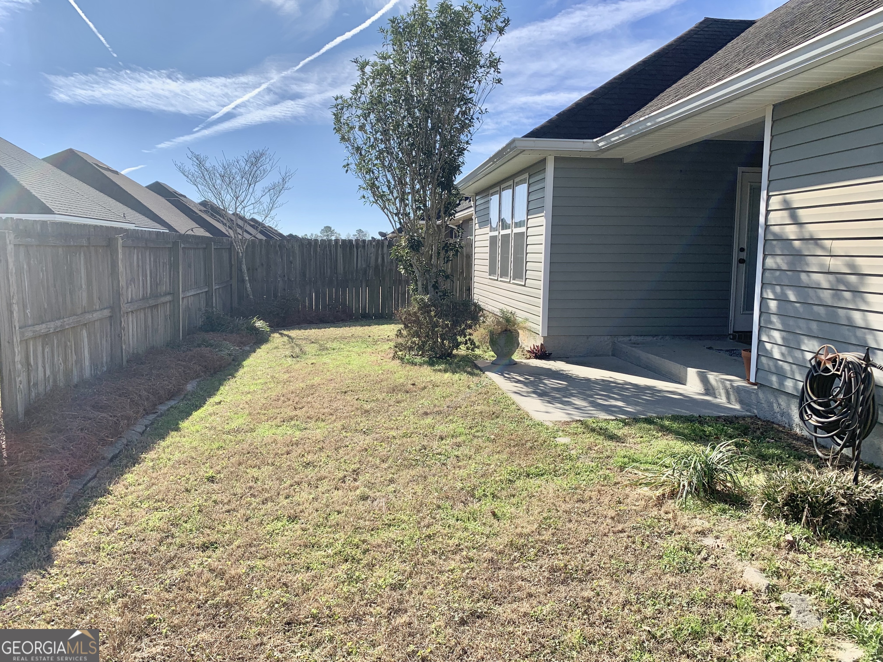 4192 Bright Creek Road Hahira, GA 31632 - Photo 27 of 28 a view of a backyard with a tree