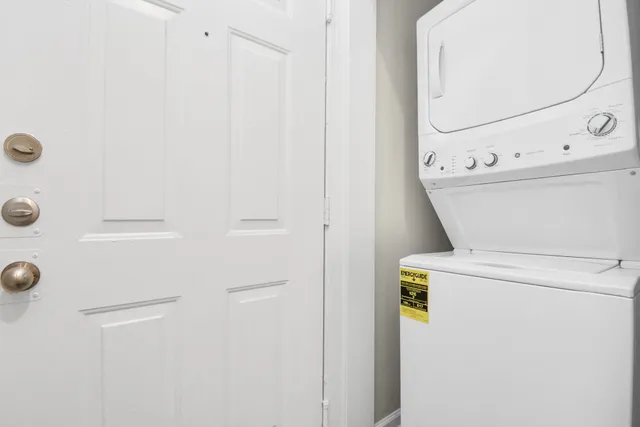 a living room with furniture and large windows