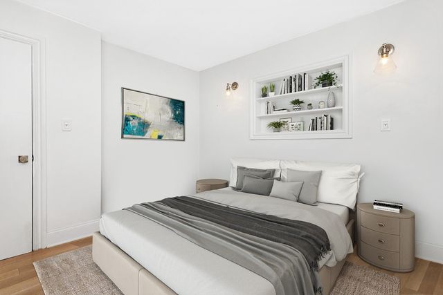 a bedroom with a bed and the wall painting