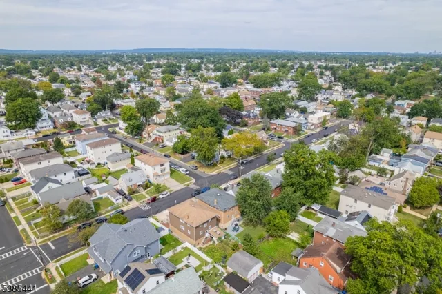 an aerial view of multiple house with yard