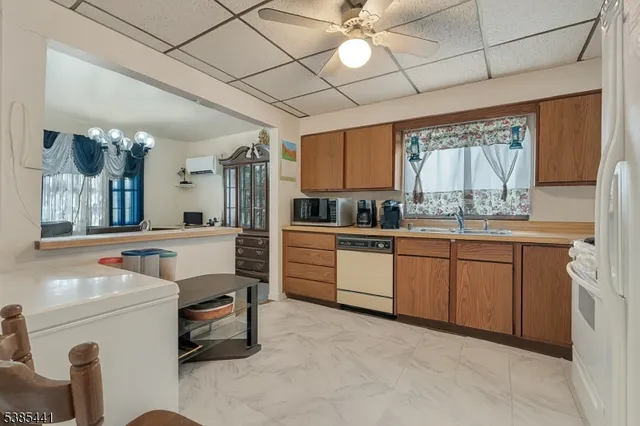 a kitchen with sink cabinets and window