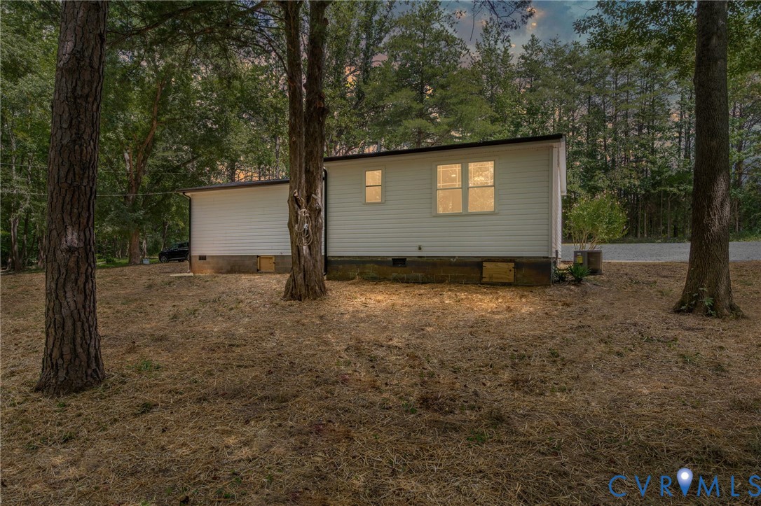 14501 Hopeful Church Road Bumpass, VA 23024 - Photo 2 of 33 a backyard of a house with lots of green space