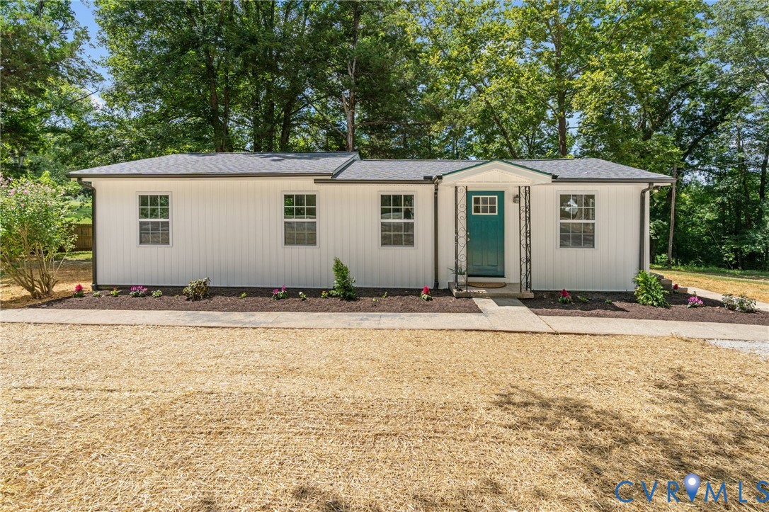 14501 Hopeful Church Road Bumpass, VA 23024 - Photo 4 of 33 a front view of house with yard and trees around