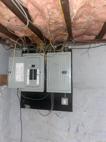 a room with wooden walls and windows