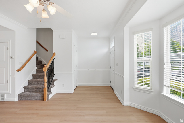 793 North 150 E Street Springville, UT 84663 - Photo 5 of 26 Light wood-finish flooring complements the white wall finishes and crown molding