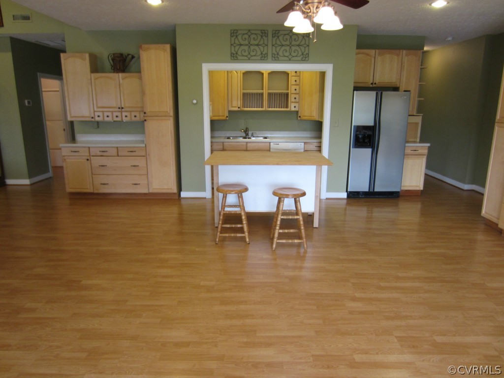 600 Three Chopt Road Manakin-Sabot, VA 23103 - Photo 11 of 24 a kitchen with stainless steel appliances kitchen island granite countertop a refrigerator and a stove top oven