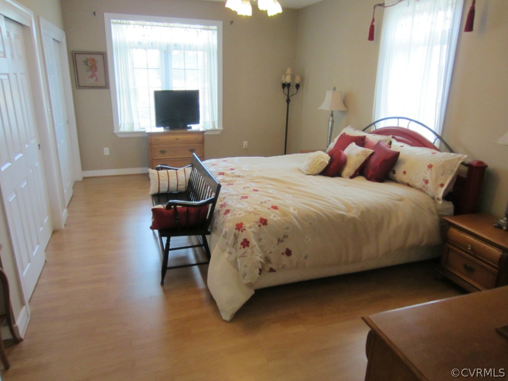 600 Three Chopt Road Manakin-Sabot, VA 23103 - Photo 12 of 24 a bedroom with a bed and a flat screen tv