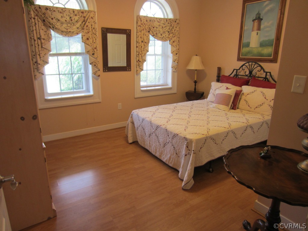 600 Three Chopt Road Manakin-Sabot, VA 23103 - Photo 14 of 24 a bed sitting in a bedroom next to a window