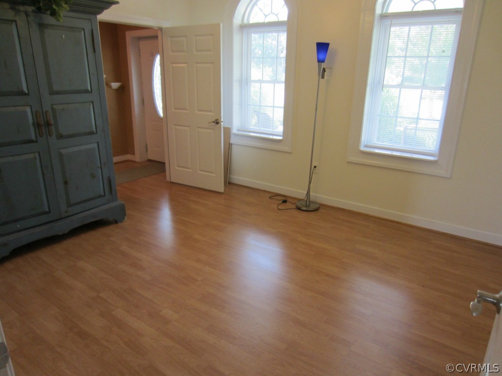 600 Three Chopt Road Manakin-Sabot, VA 23103 - Photo 17 of 24 an empty room with wooden floor and windows