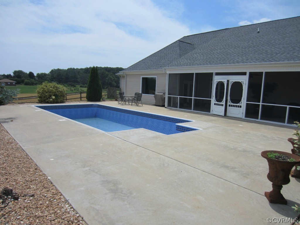 600 Three Chopt Road Manakin-Sabot, VA 23103 - Photo 20 of 24 a view of swimming pool in front of residential house with outdoor seating