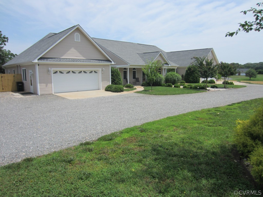 600 Three Chopt Road Manakin-Sabot, VA 23103 - Photo 21 of 24 a front view of a house with a yard and garage