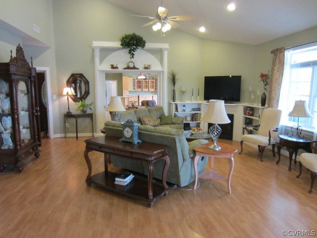 600 Three Chopt Road Manakin-Sabot, VA 23103 - Photo 5 of 24 a living room with furniture a flat screen tv and a fireplace