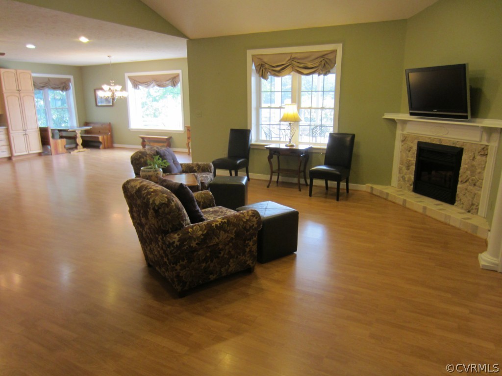 600 Three Chopt Road Manakin-Sabot, VA 23103 - Photo 9 of 24 a living room with fireplace furniture and a flat screen tv