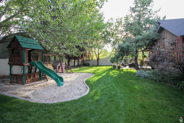 288 525 South Providence, UT 84332 - Photo 51 of 71 View of jungle gym with a fenced backyard