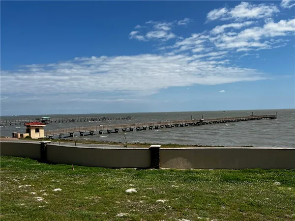 a view of a swimming pool and an outdoor seating