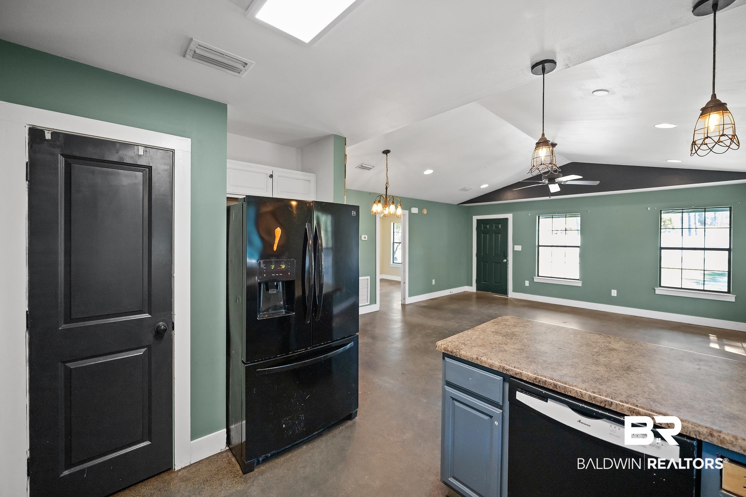 2000 Maria Lane Lillian, AL 36549 - Photo 33 of 35 Kitchen with finished concrete floors, black appliances, decorative light fixtures, open floor plan, and a ceiling fan