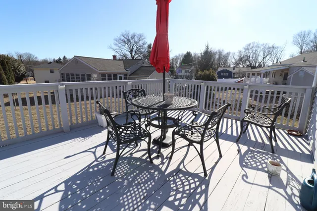 a view of a chairs and table on the deck