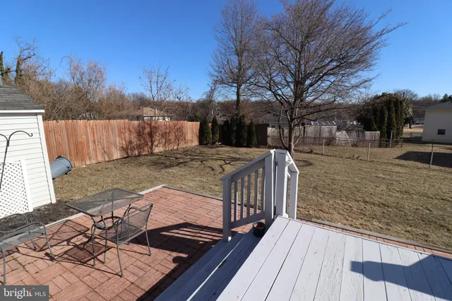 a view of a backyard with wooden floor