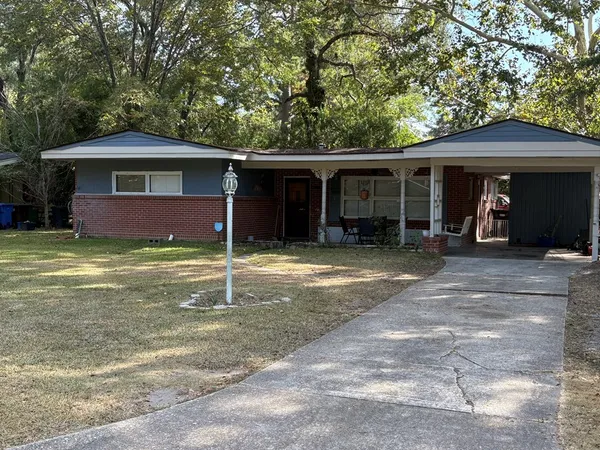 a house with trees in the background