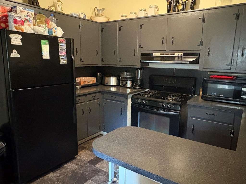 4160 Spirea Drive Columbus, GA 31907 - Photo 6 of 10 a kitchen with a appliances and cabinets
