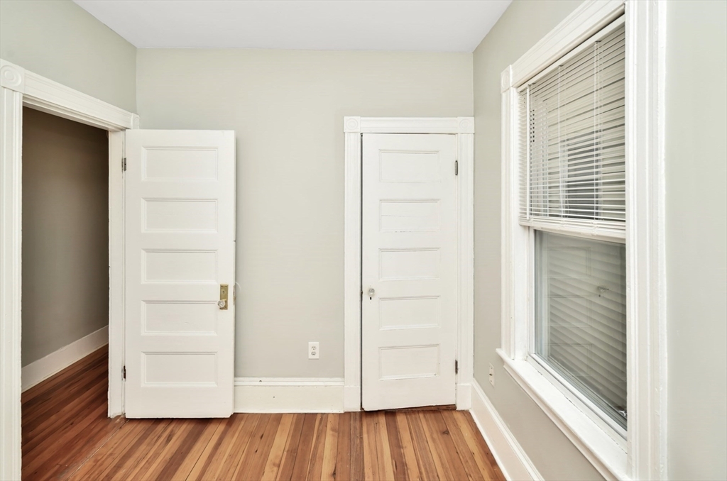6 Coleman Street, Unit 2 Boston, MA 02125 - Photo 14 of 19 a view of a hallway with wooden floor and closet