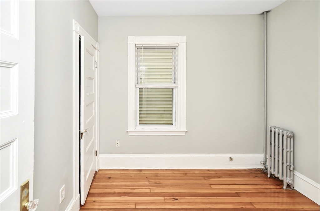 6 Coleman Street, Unit 2 Boston, MA 02125 - Photo 15 of 19 a view of a room with wooden floor and a window