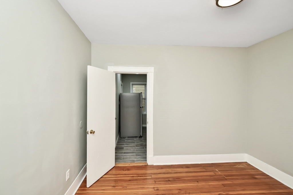 6 Coleman Street, Unit 2 Boston, MA 02125 - Photo 7 of 19 a view of a room with wooden floor and bench