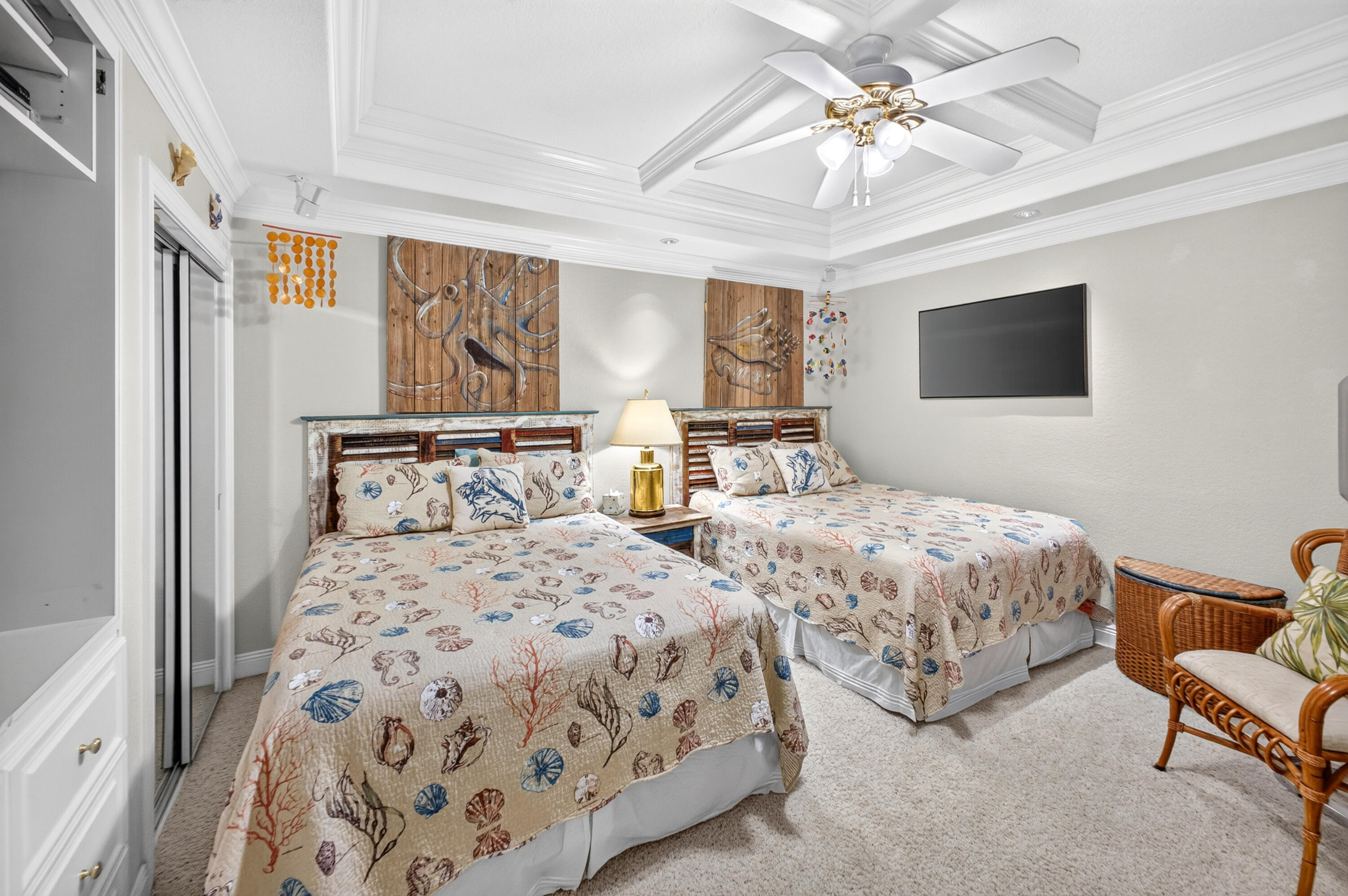 30 Moreno Point Road, Unit 703A Destin, FL 32541 - Photo 42 of 60 a bedroom with two beds and a chandelier