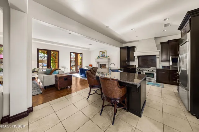 a bedroom with a bed a dresser and a window