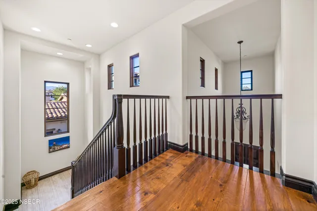 a bathroom with a granite countertop sink toilet a large mirror a bathtub and shower