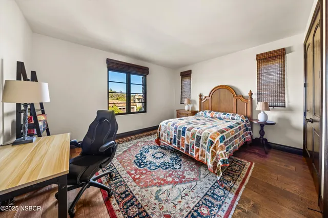 a bed room with a bed and a chair