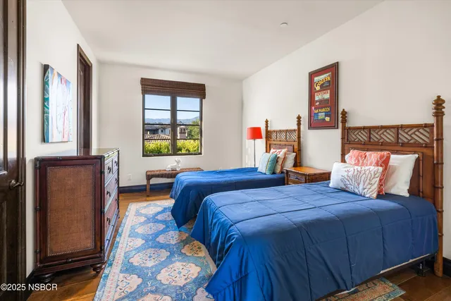 a bedroom with a bed and a desk