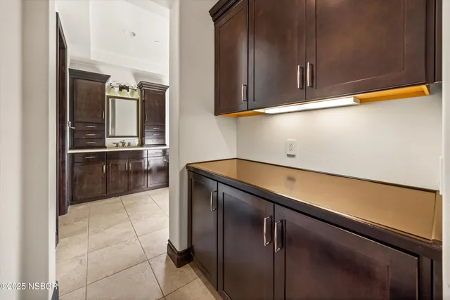 a view of a patio with a table chairs and a fire pit