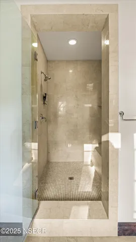 a view of a house with a small yard and furniture