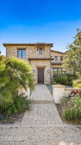 a living room with furniture a piano and a flat screen tv