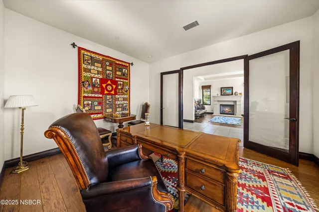 a view of entryway with wooden floor and stairs