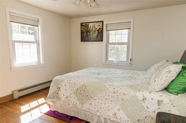 85 Rinaldo Road Weymouth, MA 02191 - Photo 9 of 13 a bedroom with a bed and a window