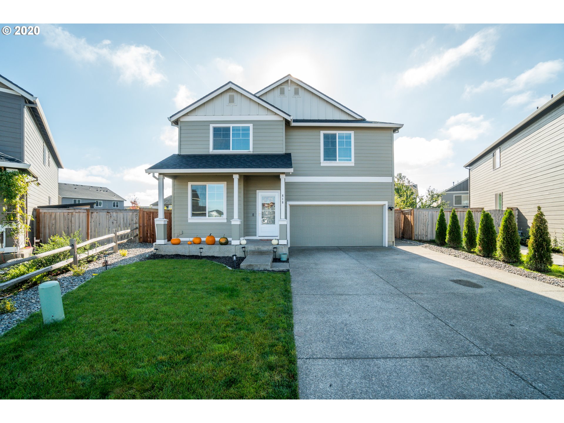 818 North Gibert Court Ridgefield, WA 98642 - Photo 1 of 30 a front view of a house with a yard and garage