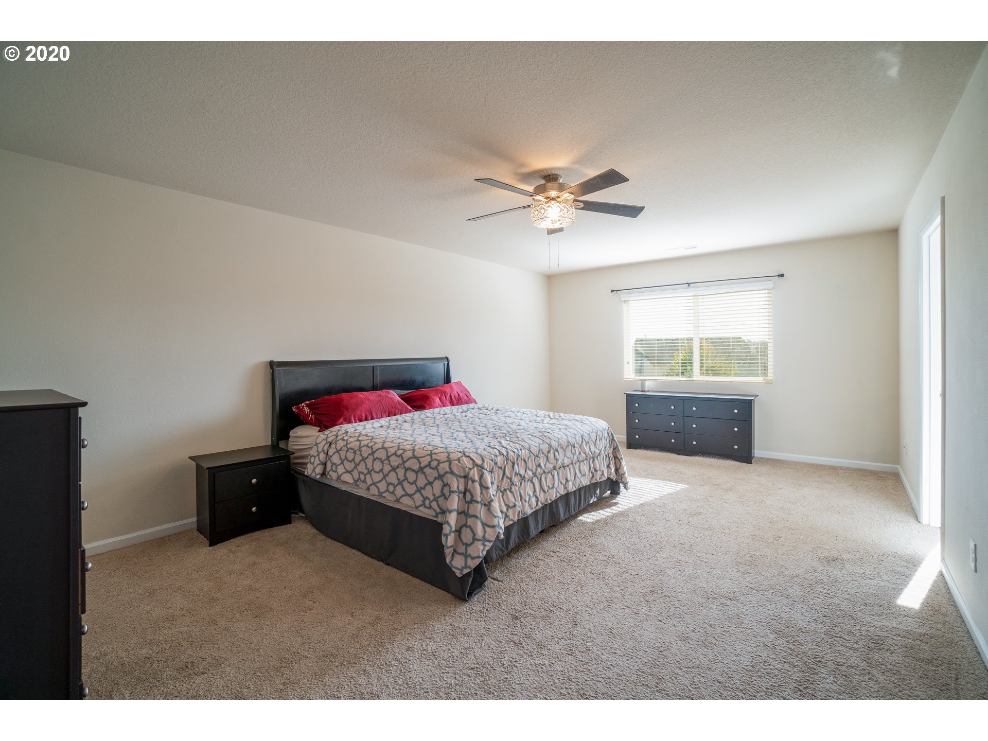 818 North Gibert Court Ridgefield, WA 98642 - Photo 13 of 30 a bedroom with a bed and a window