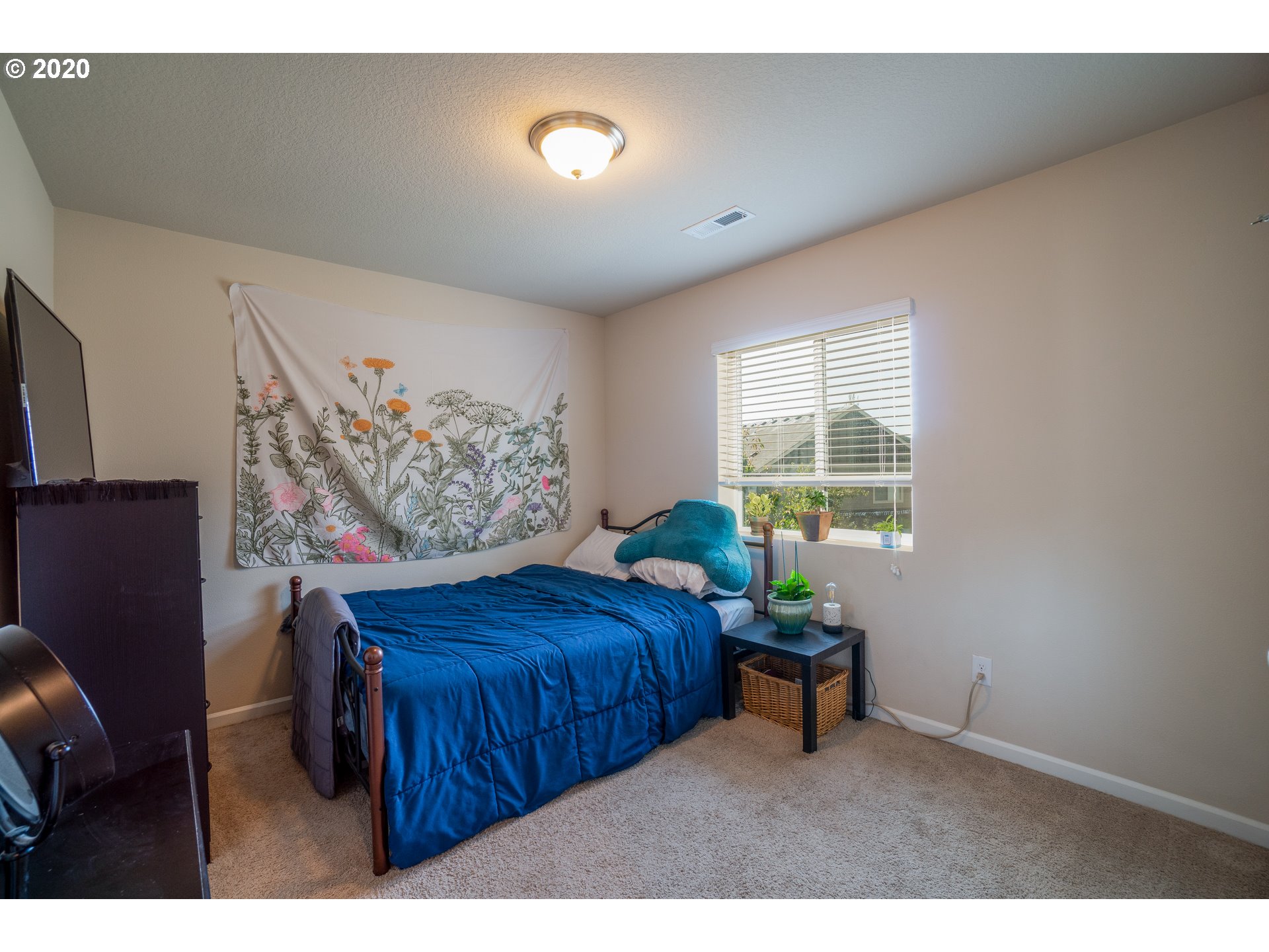818 North Gibert Court Ridgefield, WA 98642 - Photo 16 of 30 a bedroom with a bed and a window