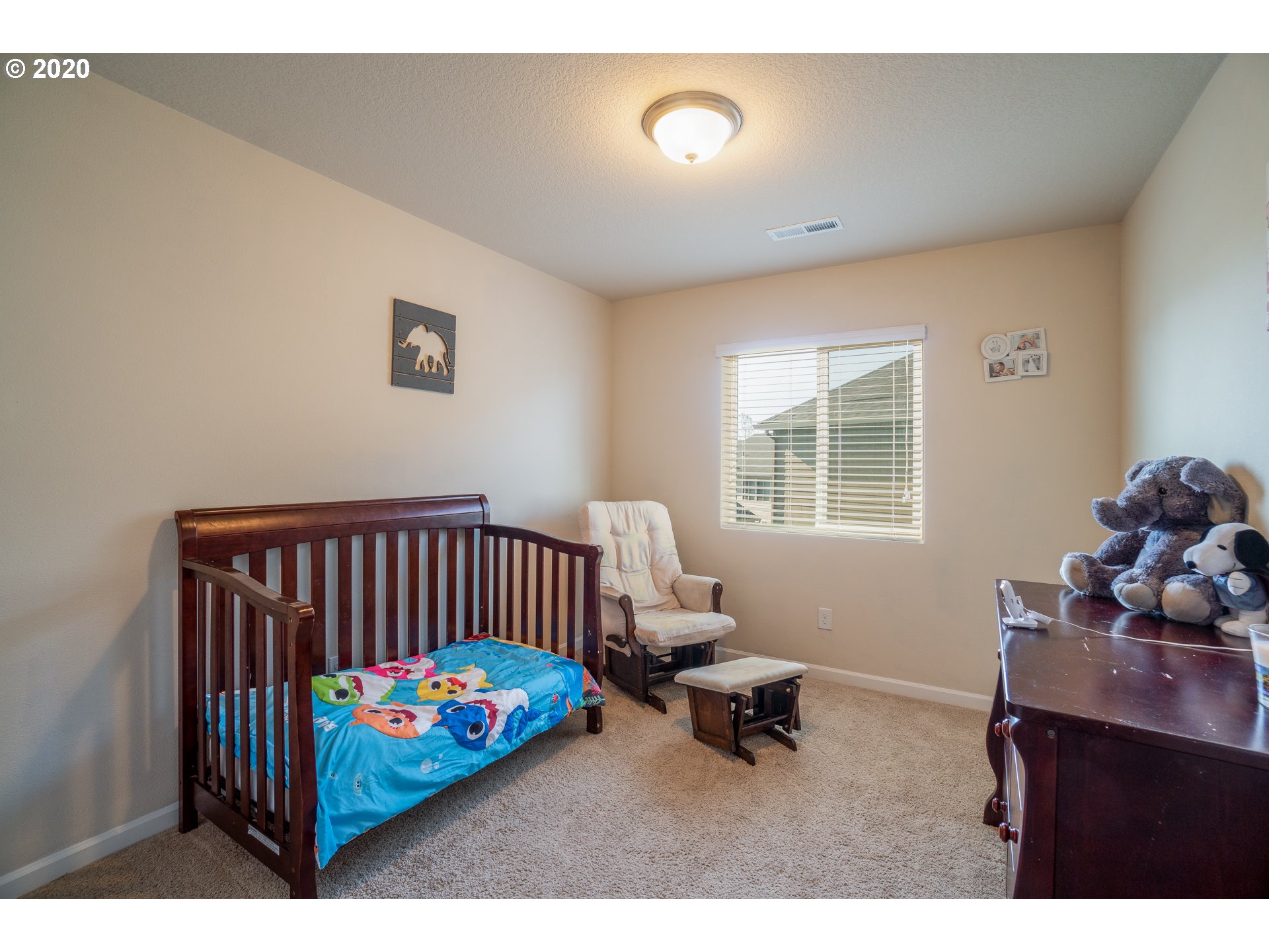 818 North Gibert Court Ridgefield, WA 98642 - Photo 17 of 30 a bedroom with a bed and a window